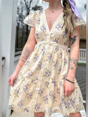NWT PATRONS OF PEACE
Cream-colored mini dress with floral pattern